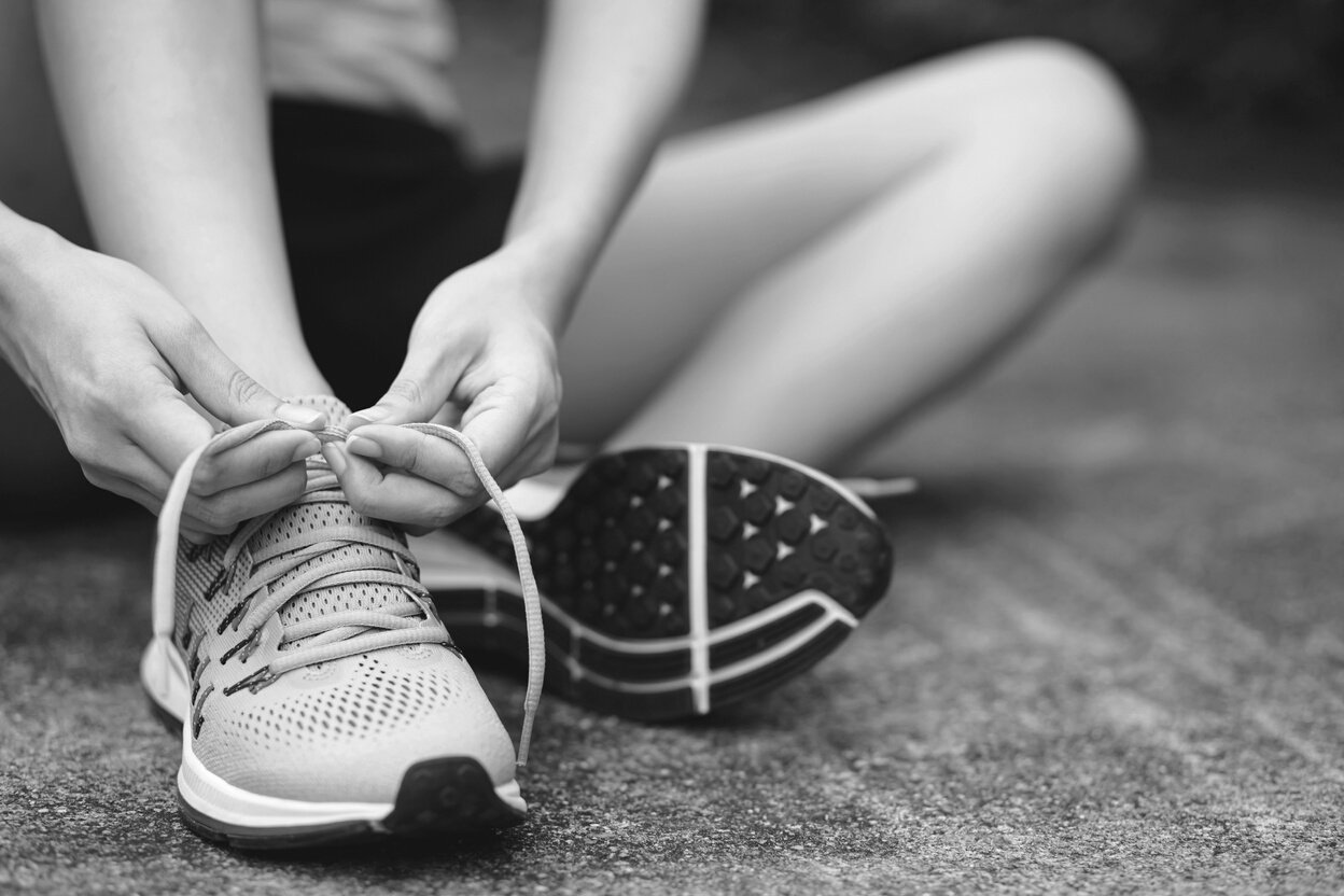 Runner Tying Her Shoes Up Close